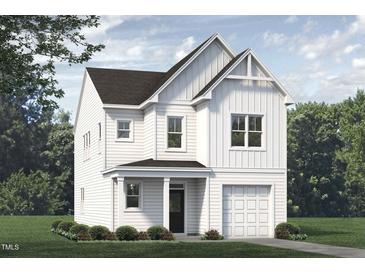 Charming two-story home featuring a modern design with white siding and a cozy front porch, completed with an attached garage at 71 Furley St, Homesite 116, Sanford, NC 27330