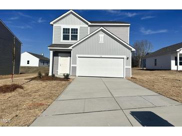 Charming two-story home featuring gray siding, a two-car garage, and a well-manicured front lawn at 1161 Centerview Drive, Nashville, NC 27856