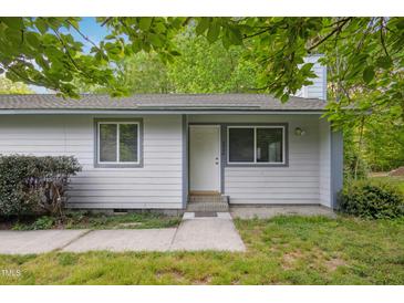 Charming single-story home with light gray siding, updated windows, and a well-kept front yard at 292 Cedar Lake Rd # A, Chapel Hill, NC 27516