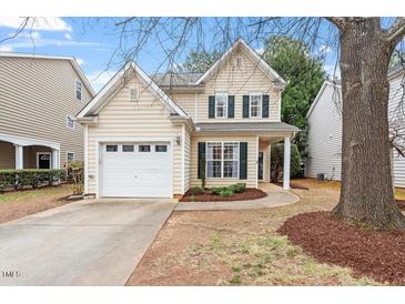Charming two-story home with a well-manicured lawn and attached garage, perfect for a Gathering at 8412 Lunar Stone Pl, Raleigh, NC 27613