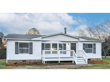 Charming home featuring a front porch, white siding, and black shutters at 110 Hickory Dr, Spring Hope, NC 27882