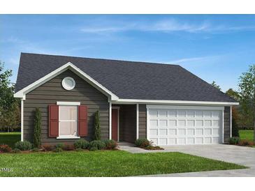 Charming single-story home with a well-manicured lawn, attached garage, and complementary window shutter accents at 83 Orchard St, Lillington, NC 27546