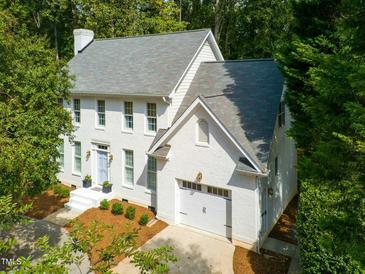 Charming two-story home with landscaped yard and attached garage at 1222 Dixie Trl, Raleigh, NC 27607