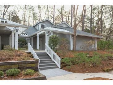 Inviting two-story home with a well-maintained lawn and welcoming front entrance at 103 Kirkwood Dr., Chapel Hill, NC 27514