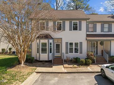 Charming townhome featuring neutral siding, gray shutters, and a delightful bay window at 12 Citation Dr, Durham, NC 27713