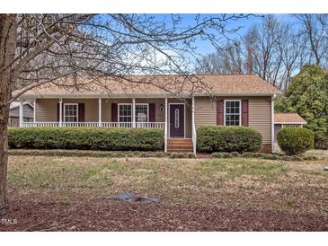 Charming single story home featuring a cozy front porch and well-maintained landscaping at 1723 Bahama Rd, Bahama, NC 27503