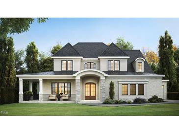 Charming two-story home boasting a stone facade, arched entryway, and covered porch perfect for relaxing at 1712 Legacy Ridge Ln, Wake Forest, NC 27587