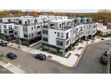 Modern townhome complex with rooftop terraces and contemporary design in a walkable urban neighborhood at 2002 Moody Ln, Durham, NC 27701