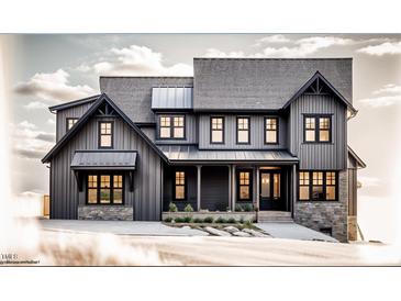 Charming two-story home with board and batten siding, stone accents, and a welcoming front porch at 422 Lower Thrift Rd, New Hill, NC 27562