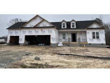 New home construction featuring a 2-car garage and dormer windows at 880 Olive Branch Dr, Smithfield, NC 27577