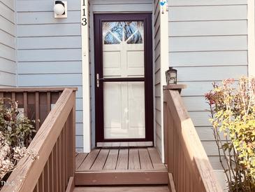 Inviting front door with glass accents and a charming entrance, number 113 at 250 S Estes S Dr # Apt 113, Chapel Hill, NC 27514