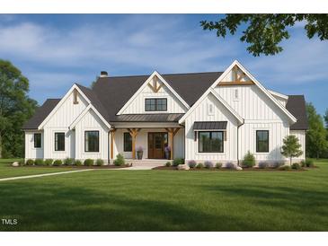Charming two-story modern farmhouse with inviting front porch and beautifully landscaped front yard at 4060 Granite Ridge Trl, Raleigh, NC 27616