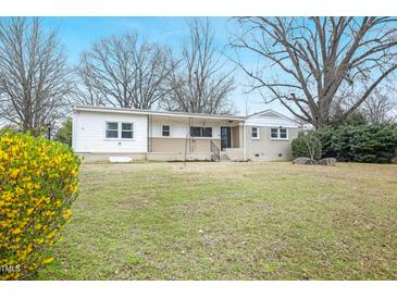 Charming single-story home with a well-maintained lawn and mature trees offering ample shade at 902 Phillip St, Garner, NC 27529