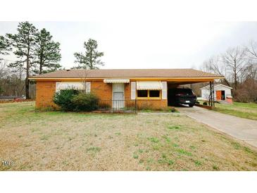 Charming brick home with covered carport and mature landscaping at 10125 Buffalo Rd, Clayton, NC 27527
