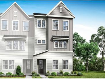 Charming new construction townhome with gray and white exterior and a welcoming front entrance at 1032 Zelkova Lane, Chapel Hill, NC 27517