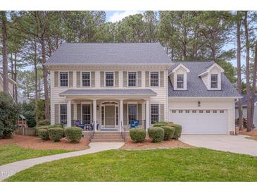 Charming two-story home with a well-manicured lawn and inviting front porch at 1609 Marshall Farm St, Wake Forest, NC 27587