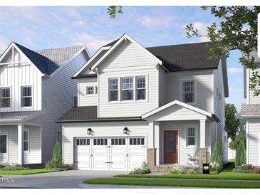 Charming two-story new construction with a welcoming porch and three-car garage at 301 Beacon Dr, Pittsboro, NC 27312