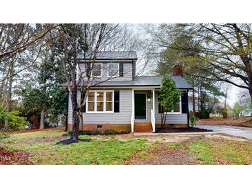 Charming two-story home with well-manicured lawn and mature trees creating curb appeal at 4604 Sweet Melody Ln, Knightdale, NC 27545