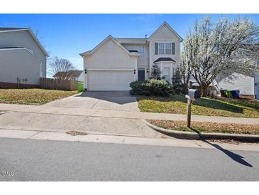 Charming two-story home with a two-car garage and well-maintained front yard at 4709 Delta Lake Dr, Raleigh, NC 27612