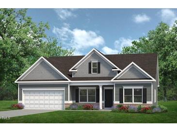 Charming single-story home with gray siding, a front-facing garage, and a manicured lawn at 86 Olivia Crossing Ct # 3, Four Oaks, NC 27524