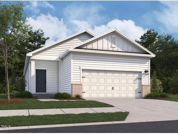 Charming single-Gathering home with a two-car garage, stone accents, and manicured lawn at 1156 Solace Way, Rolesville, NC 27571