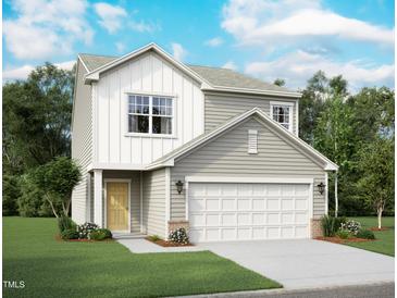 Charming two-story home with a two-car garage, landscaped yard, and a welcoming yellow front door at 1161 Solace Way, Rolesville, NC 27571