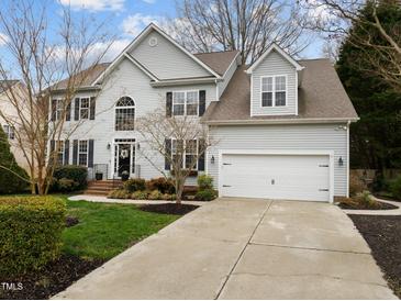 Charming two-story home features a two-car garage, well-maintained lawn and beautiful landscaping at 209 Plyersmill Rd, Cary, NC 27519