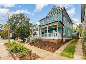 Inviting two-story home featuring a spacious front porch and classic architectural details at 101 N Bloodworth St, Raleigh, NC 27601