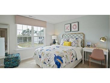 Bright bedroom featuring a patterned bedspread, a decorative headboard, and a window with natural light at 106 Craig Point Dr, Clayton, NC 27520