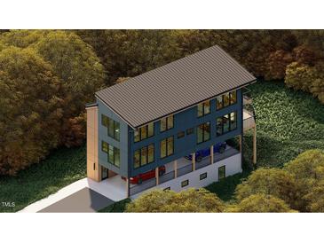 Modern home featuring a unique cantilevered design, a flat roof, large windows, and an attached garage at 1709 Evergreen Ave, Raleigh, NC 27603