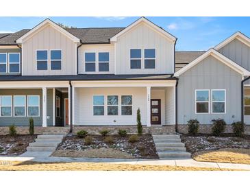 Charming new construction townhome with modern design and inviting front porch at 3933 Willow Gate Way, Knightdale, NC 27604