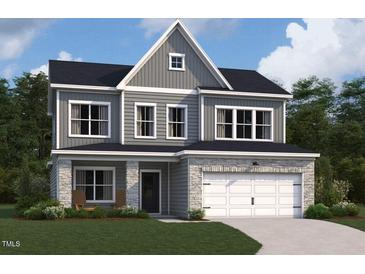 Charming two-story home with stone accents, gray siding, and a two-car garage at 130 W Crescent Mills Blvd # Homesite 251, Wilson's Mills, NC 27520