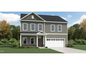 Charming two-story home with a two car garage and stone accents on the front elevation at 1564 Bright Coral Trl, Wendell, NC 27591