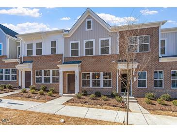 Beautiful brick townhome with multiple windows and landscaping in a well-maintained community at 256 Chesapeake Commons St # 157, Garner, NC 27529