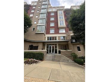 Apartment building with well maintained landscaping and red brick architecture at 618 N Boylan Avenue # 300, Raleigh, NC 27603