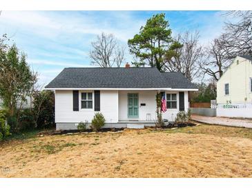 Charming one-story home with white siding, black shutters, and a neatly maintained front yard at 1817 Rankin St, Raleigh, NC 27604