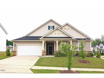 Charming single-Gathering home with a well-maintained lawn and attached two-car garage at 117 Oak Rise Ln, Fuquay Varina, NC 27526