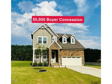 Charming two-story home with stone accents, landscaped yard, and a $5,000 buyer concession at 125 Scotland Dr, Youngsville, NC 27596
