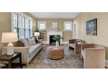 Inviting living room features a cozy fireplace, comfortable seating, and natural light at 2401 Englewood Ave, Durham, NC 27705