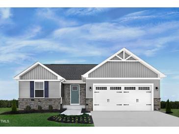 Charming single-Gathering home featuring stone accents, blue door, and an attached two-car garage at 37 Artesa Ct, Fuquay Varina, NC 27526
