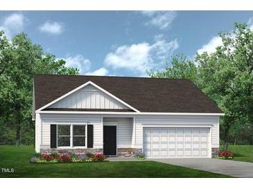 Charming single-story home with a two-car garage, beautiful landscaping, and excellent curb appeal at 274 Deodora Ln, Cameron, NC 28326