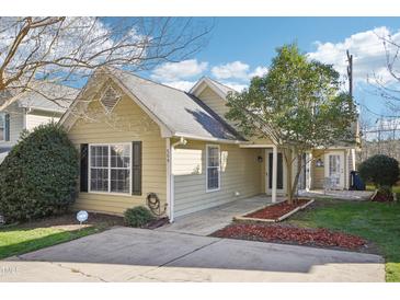 Charming one-story home with a well-maintained lawn, established trees, and neutral siding at 509 High Ridge Dr, Durham, NC 27707
