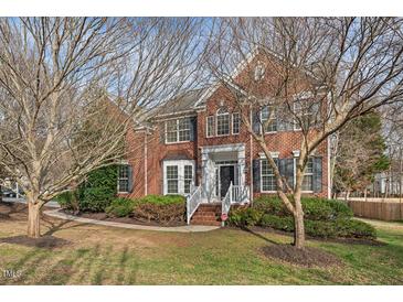 Charming two-story brick home with a manicured lawn and inviting front entrance at 7 Starwood Ln, Durham, NC 27712
