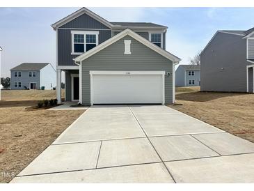 Charming two-story home featuring a garage and well-manicured lawn in a desirable neighborhood at 1149 Centerview Drive, Nashville, NC 27856