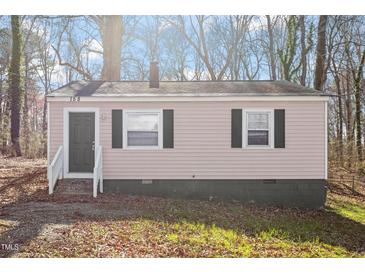 Charming home featuring a quaint front porch and symmetrical window placements at 158 Torain St, Hillsborough, NC 27278