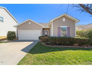 Charming one-story home with well-manicured lawn and attached two-car garage at 463 Kerriann Ln, Clayton, NC 27520