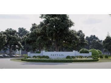 A serene entrance to Cattail is marked by lush landscaping and a welcoming sign at 74 Alex Farm Ct # 22, Zebulon, NC 27597