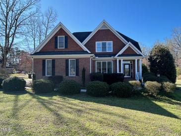 Charming two-story brick home with well-maintained landscaping at 3709 Valley Pine Ct, Wendell, NC 27591