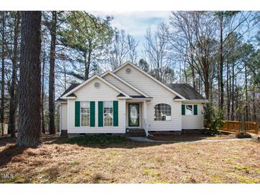 Charming single-story home featuring a well-maintained yard and lush surrounding trees at 2776 Jordan Ct, Creedmoor, NC 27522