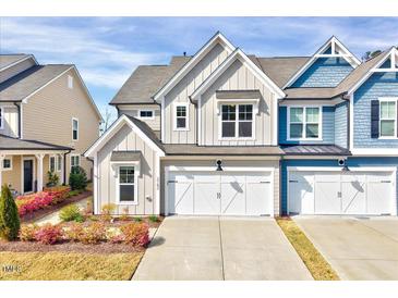 Charming home featuring a two-car garage, tidy landscaping, and Craftsman-style architecture at 3162 Retama Run # 231, Apex, NC 27562